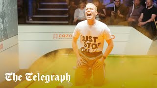 Just Stop Oil protester storms table at World Snooker Championship [upl. by Ylremik971]